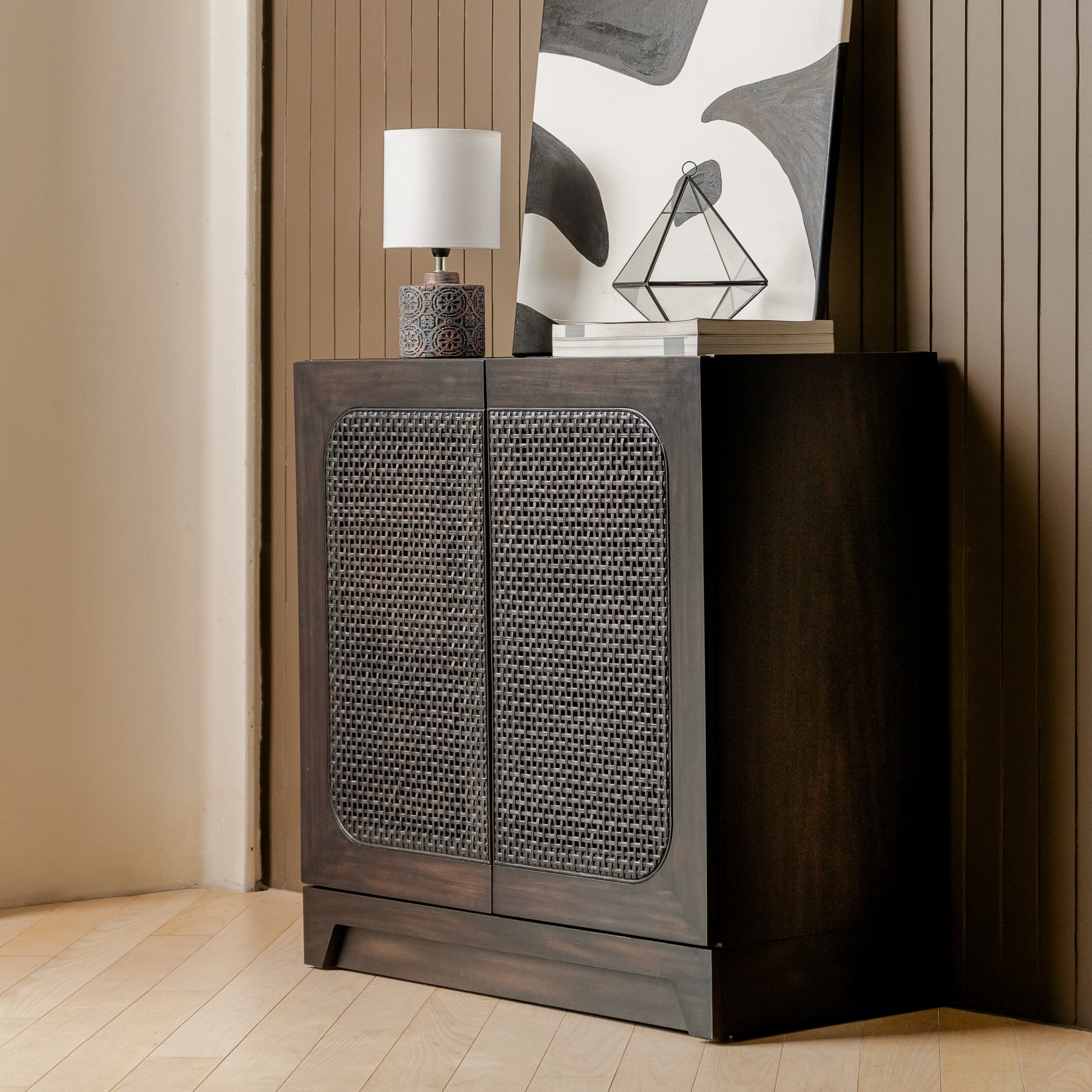 Wooden cabinet with wicker door design in a room setting