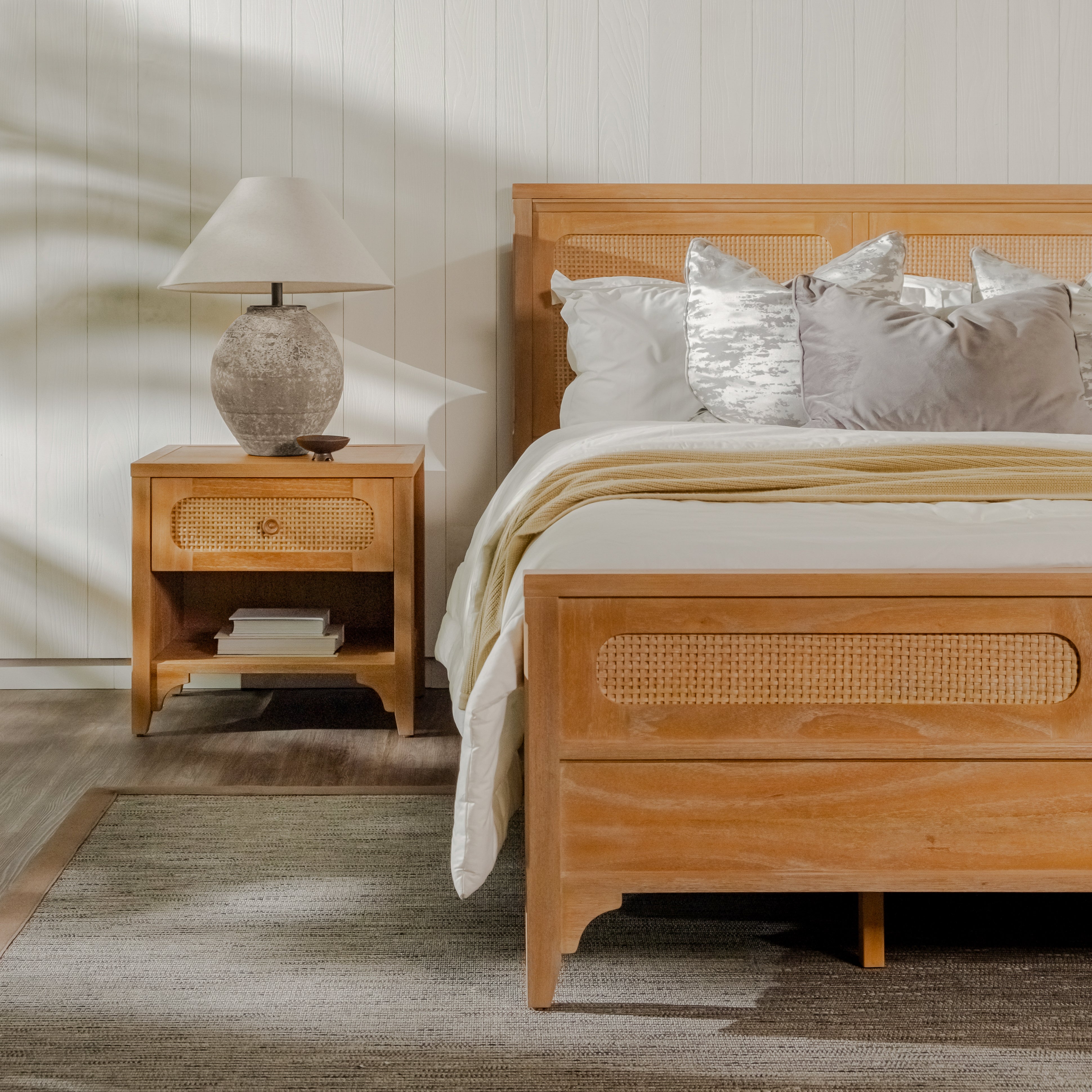 Wooden bed with wicker accents in a bedroom setting