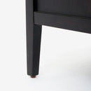 Black wooden leg of a piece of Black Kalana - 2-Drawer Rattan Nightstand