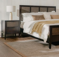 Bedroom with a bed, Black Kalana - 2-Drawer Rattan Nightstand, and lamp in a home setting