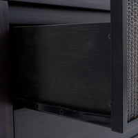 Close-up of a chair with woven backrest and dark wooden frame.