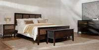 Bedroom with wooden bed, Black Kalana 6 Drawer Rattan Dresser , and dresser.