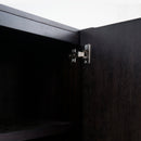Close-up of a black cabinet door with a visible hinge