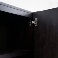 Close-up of a black cabinet door with a visible hinge