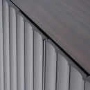 Close-up of a roofline with wooden shingles and metal flashing.