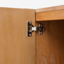Close-up of a wooden cabinet with a hinge