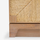 Close-up of a wooden cabinet with wicker detailing