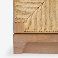 Close-up of a wooden cabinet with wicker detailing