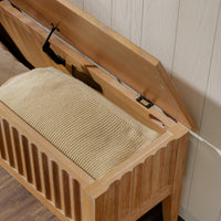 Wooden bench with a textured cushion on a wooden floor.